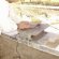 Install stone veneer over tile