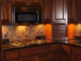 How to grout porous stone tile backsplash?
