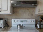 Stone subway tile kitchen backsplash