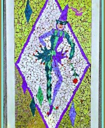 A vintage mosaic tile wall-hanging through the 1950s featuring a jester / harlequin hitting a pose with one-hand from the hip, whilst other is holding a rose. Framed in a wooden frame. Tile colors are white, green, purple, gold, and red.